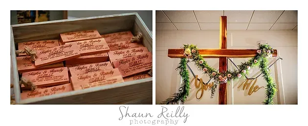 Bread loaves in a tray and a wooden cross decorated with greenery on a wall