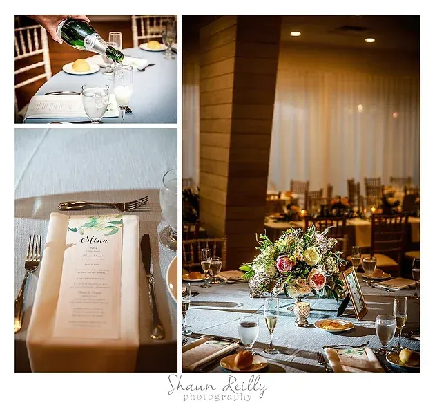 Elegant wedding reception table with floral centerpieces, candlelight, and place settings in a warm banquet hall