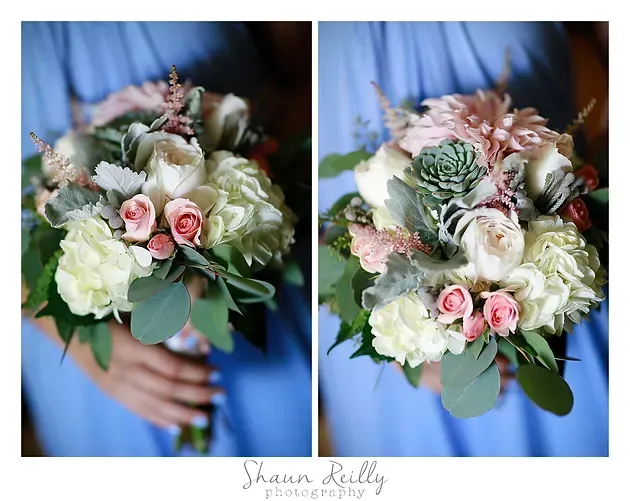 Two bridal bouquets with white, blush, and pale green flowers held in a blue-dressed hand