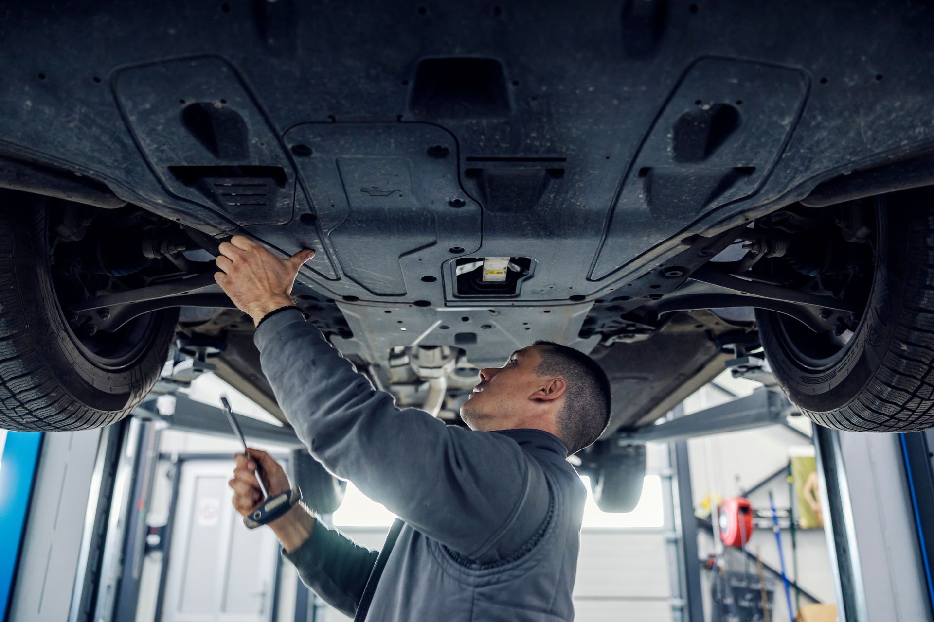 Mechanic Working on Drivetrain | Fred's Brake and Alignment