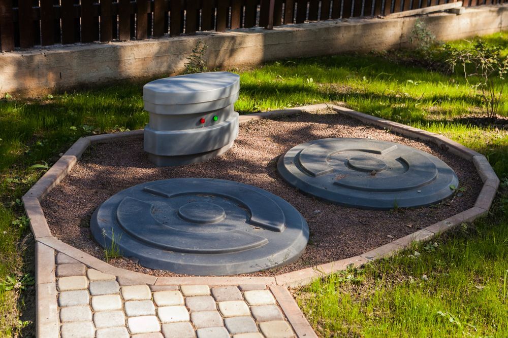Septic System Components in a Gravel Bed on Grass — Approved Plumbing Service in Woolner, NT
