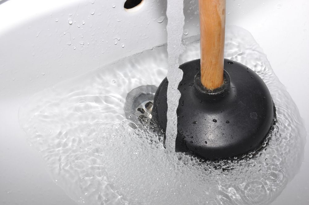 Bathroom Sink Flooding with Plunger — Approved Plumbing Service in Woolner, NT