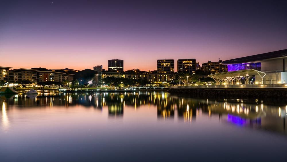 City at Night With a Lake — Approved Plumbing Service in Casuarina, NT