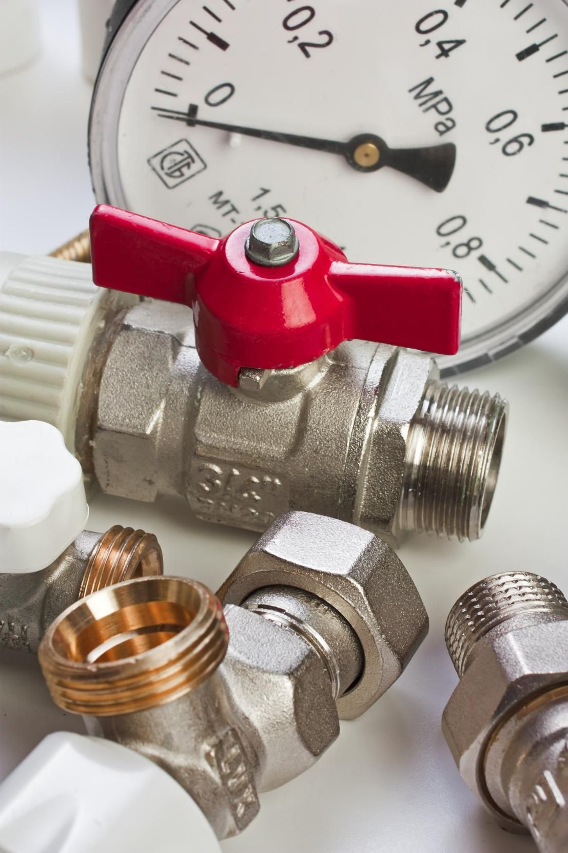 Close Up of a Valve and a Pressure Gauge on a Table — Approved Plumbing Service in Palmerston, NT