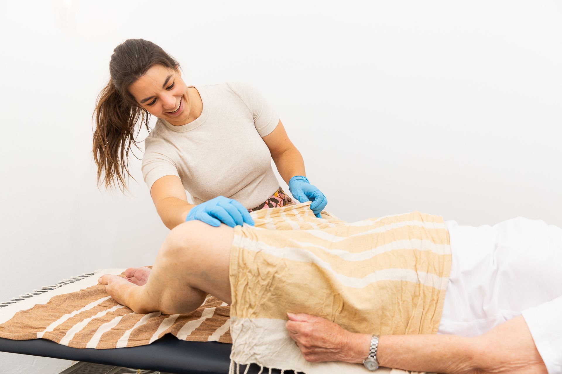 Old Lady Getting Treatment On Table — Align Health Therapies in Woonona, NSW