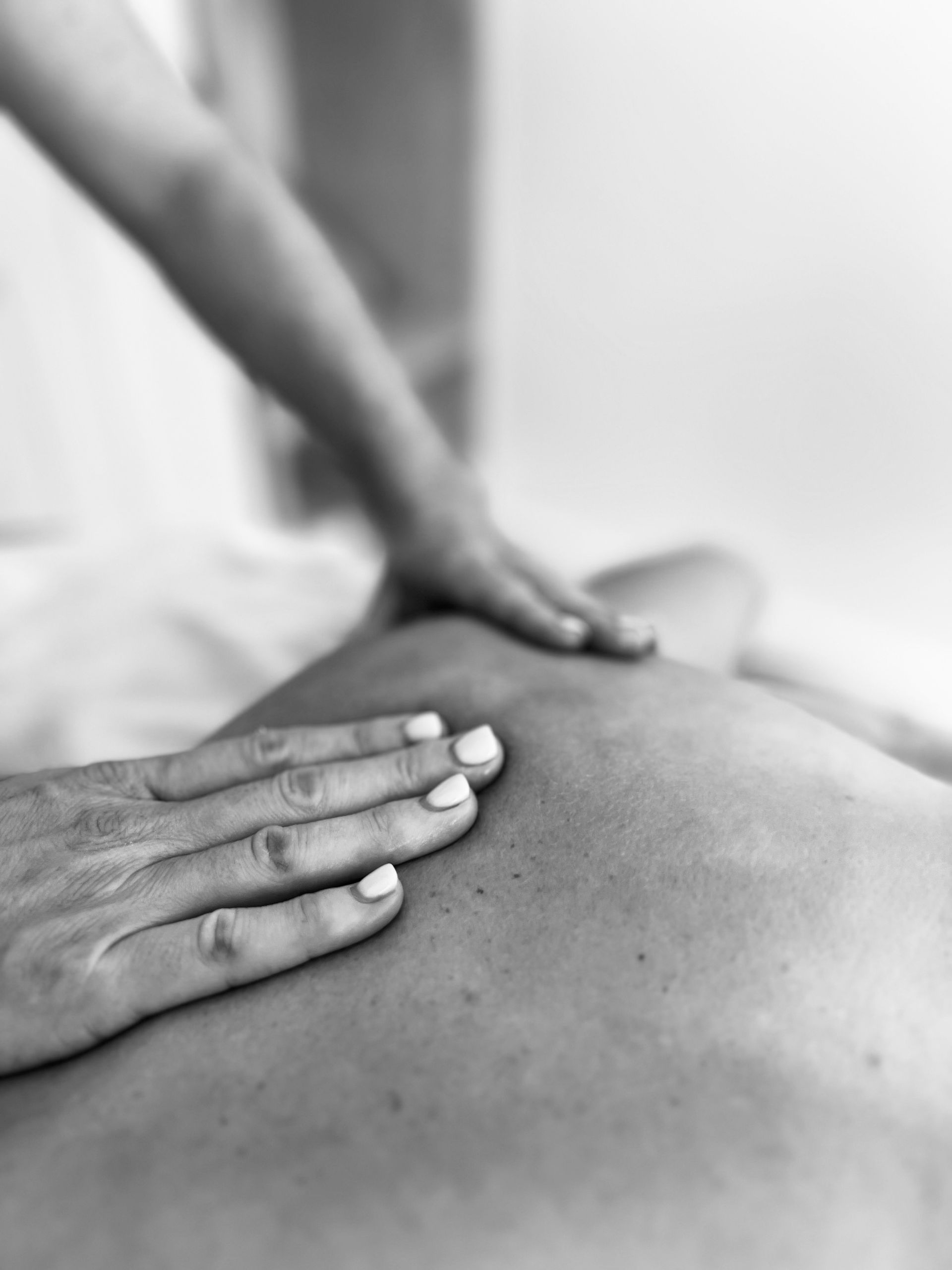A Woman Is Getting a Massage at A Spa — Align Health Therapies in Woonona, NSW