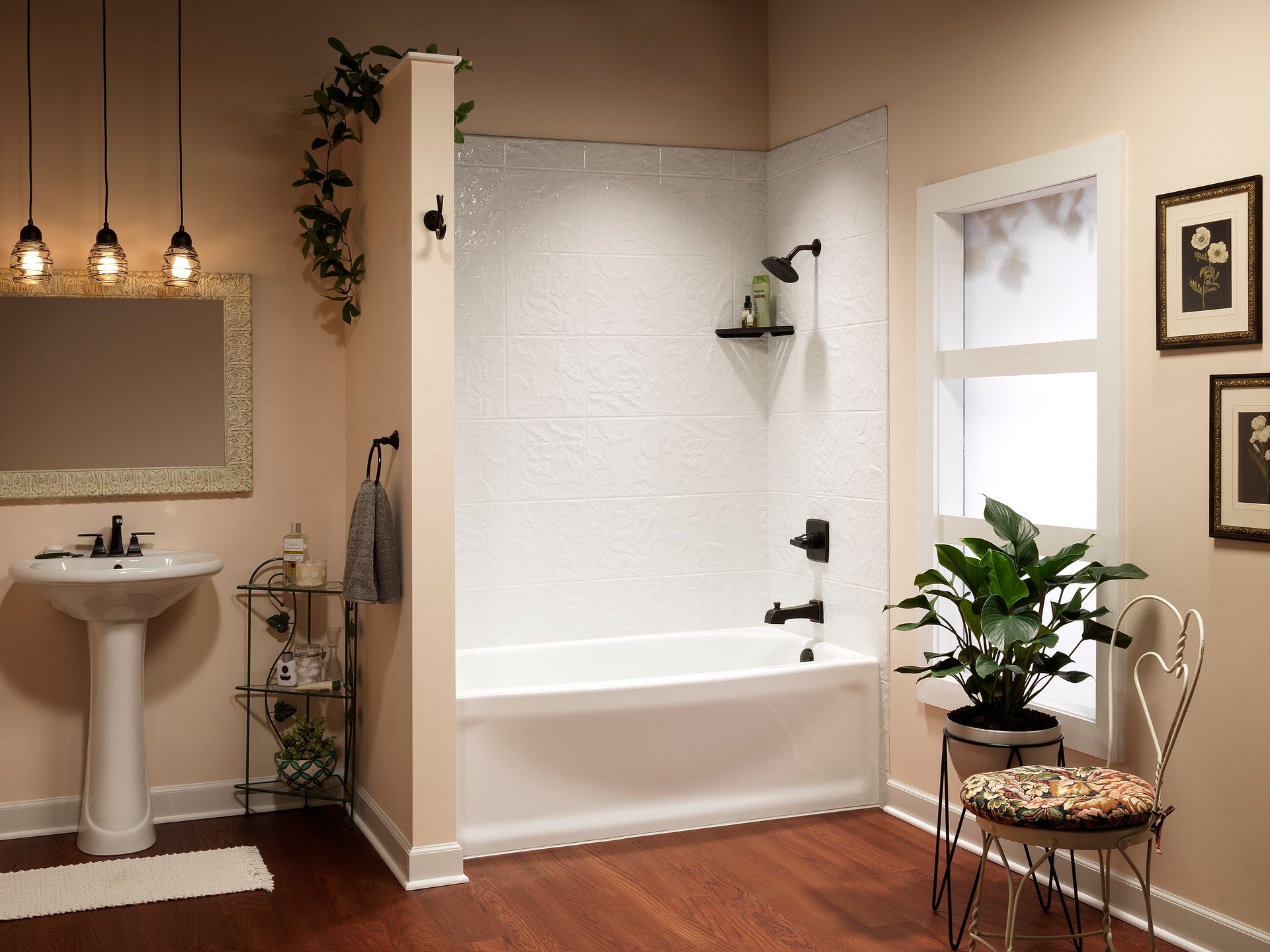 Bathroom with a white tub, shower, sink, and dark accents.