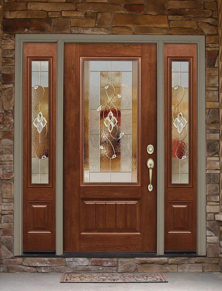 Wooden front door with stained glass panels, set in a stone wall.