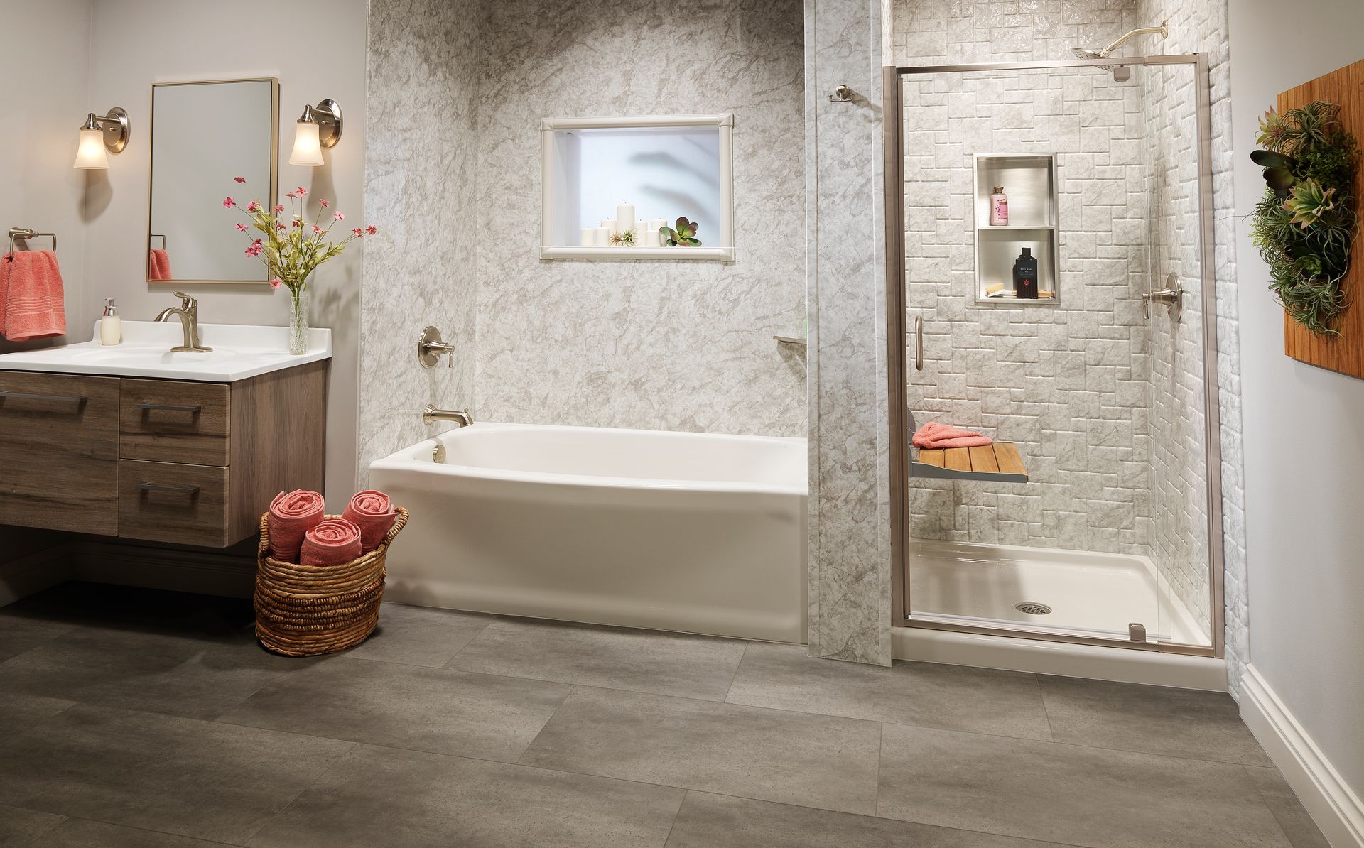 Bathroom with tub, shower, and vanity; white and gray tile, wooden vanity, gray floor.