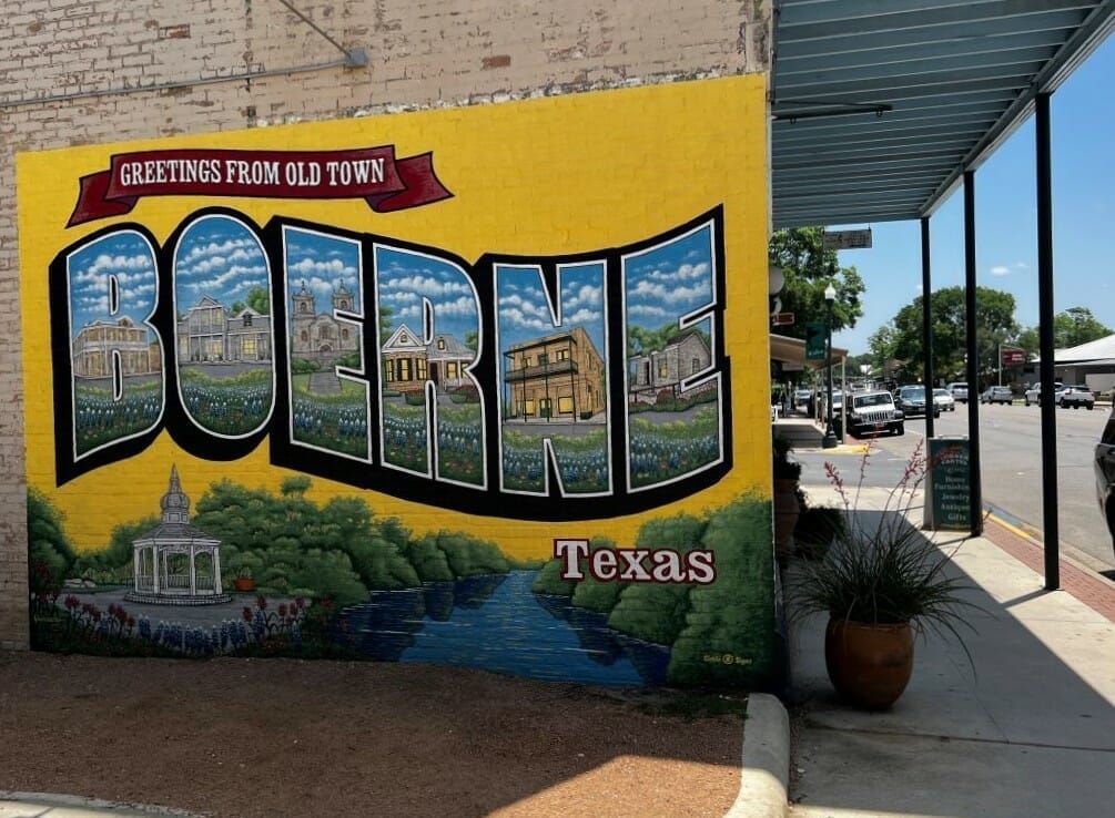 A painting of greetings from old town boerne texas
