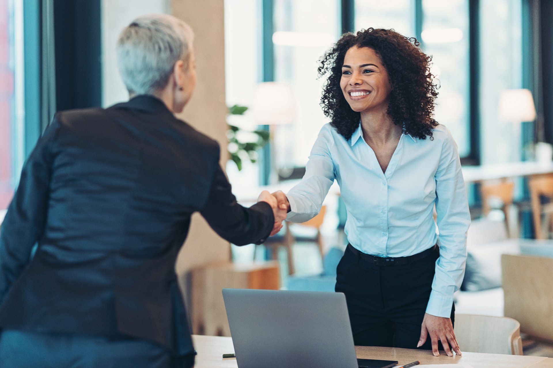 Businesswomen Shaking Hands In The Office - Marana, AZ - Essential Tax & Business Services LLC Businesswomen Shaking Hands In The Office - Marana, AZ - Essential Tax & Business Services LLC