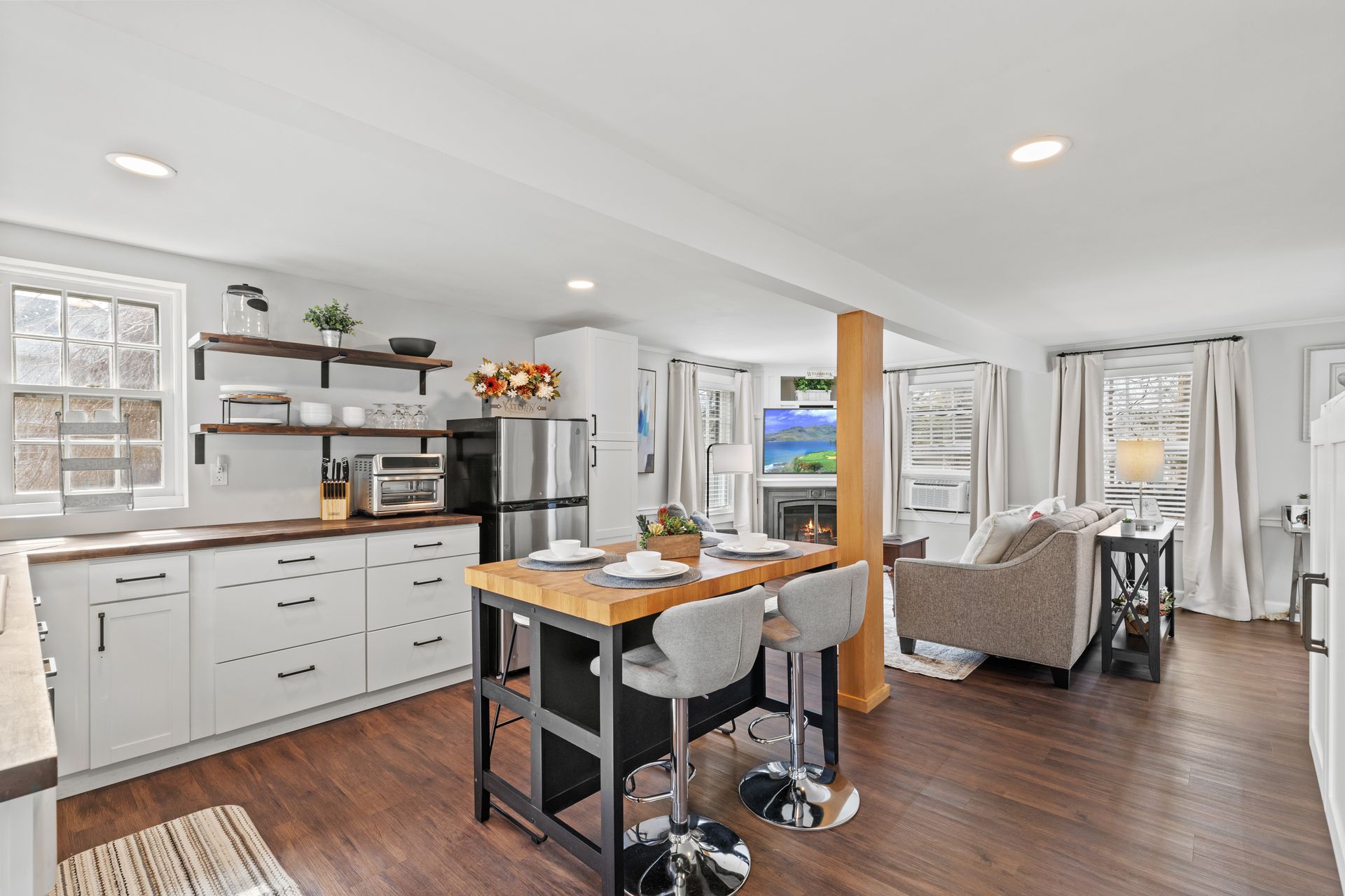 Wedding couple embrace on Westbrook porch