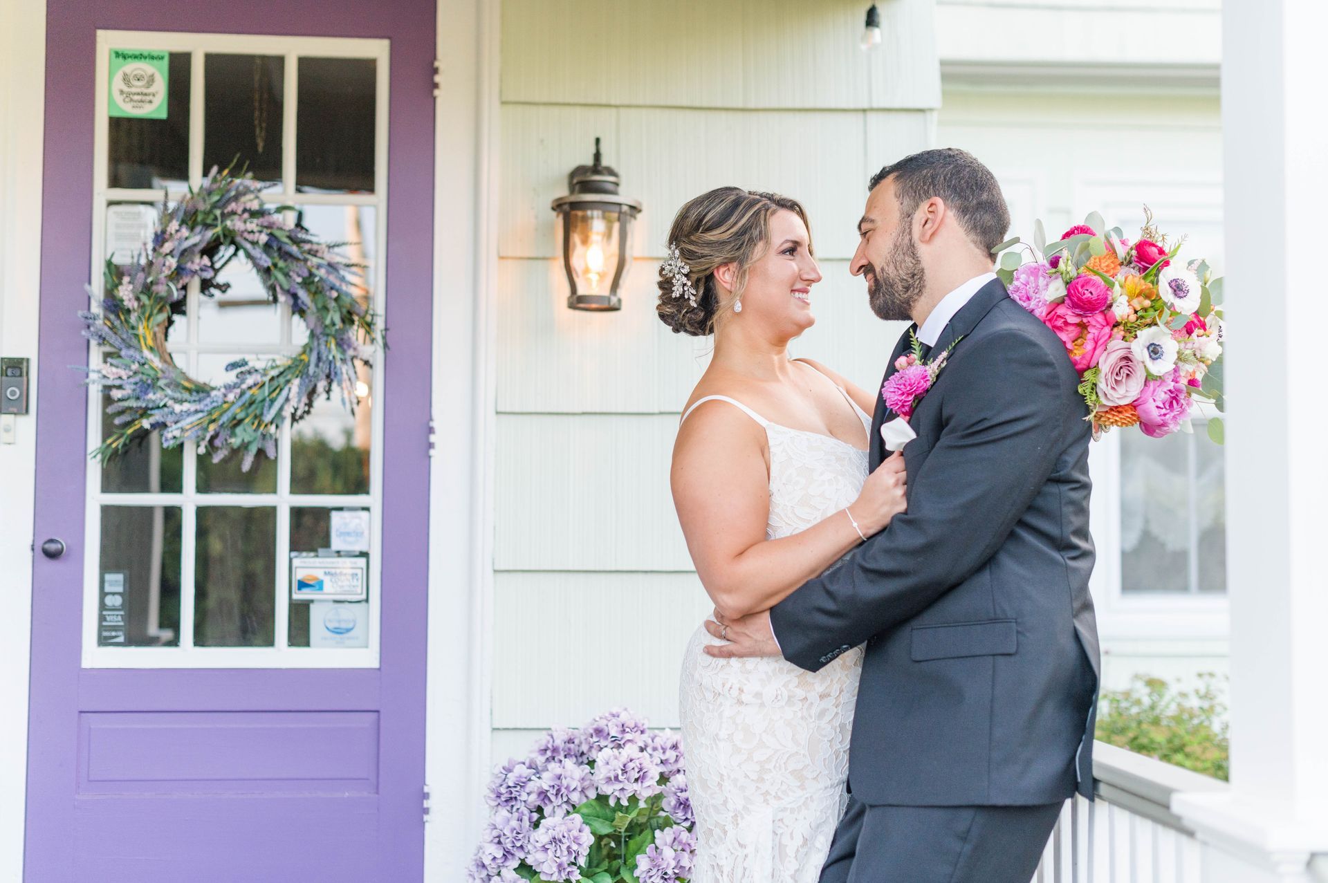 Wedding couple embrace on Westbrook porch
