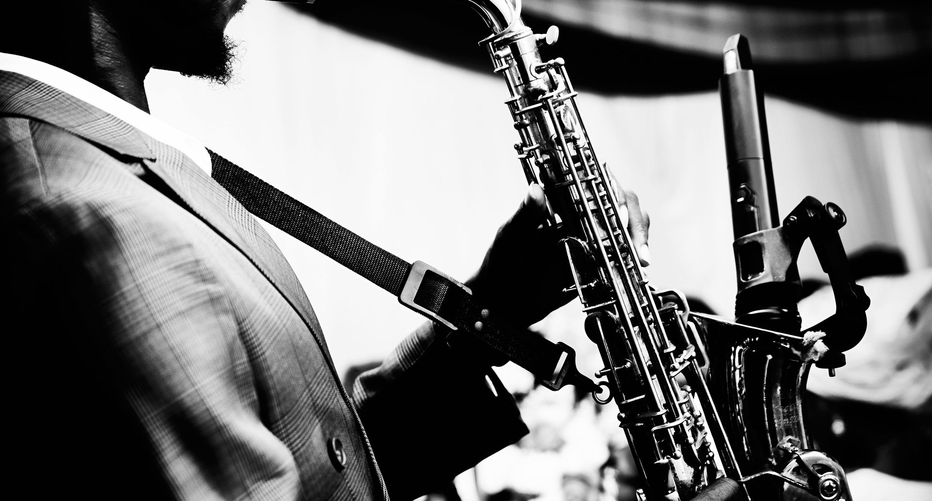 Black and white photo of someone playing the saxophone