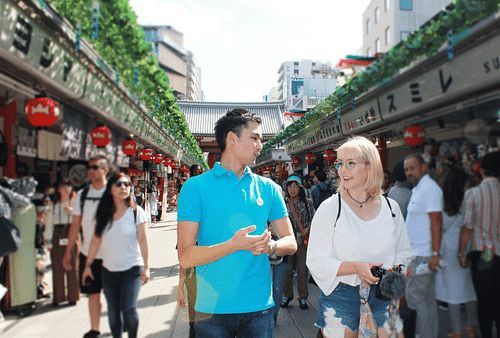 An OTOMO guide sharing local knowledge with a guest in Japan