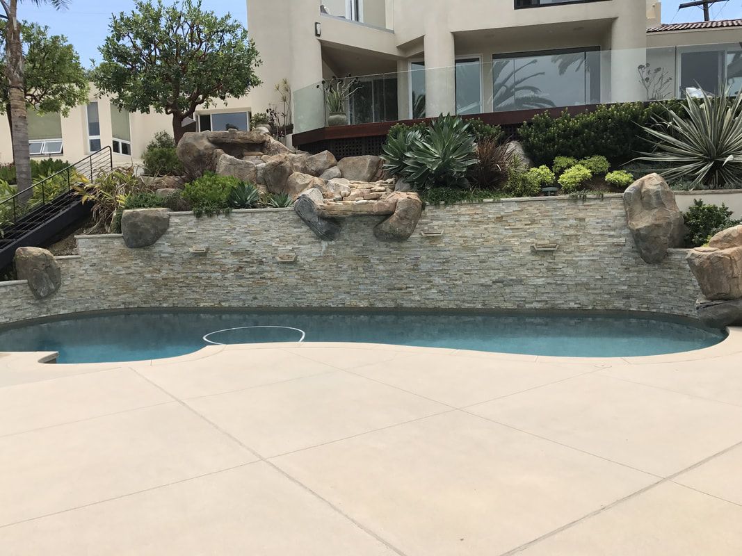 A large house with a swimming pool in front of it.