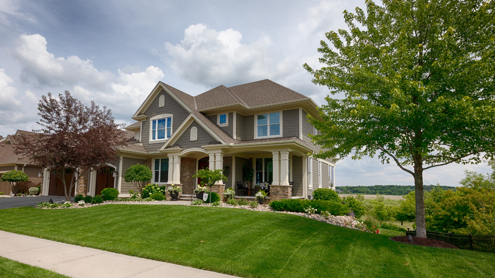 A large house with a tree in front of it