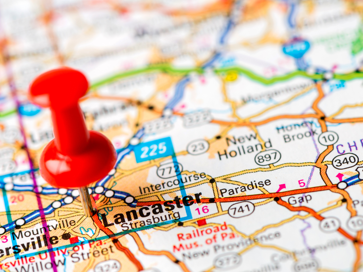 A red pin is pinned to a map of lancaster. A red pin is pinned to a map of lancaster.
