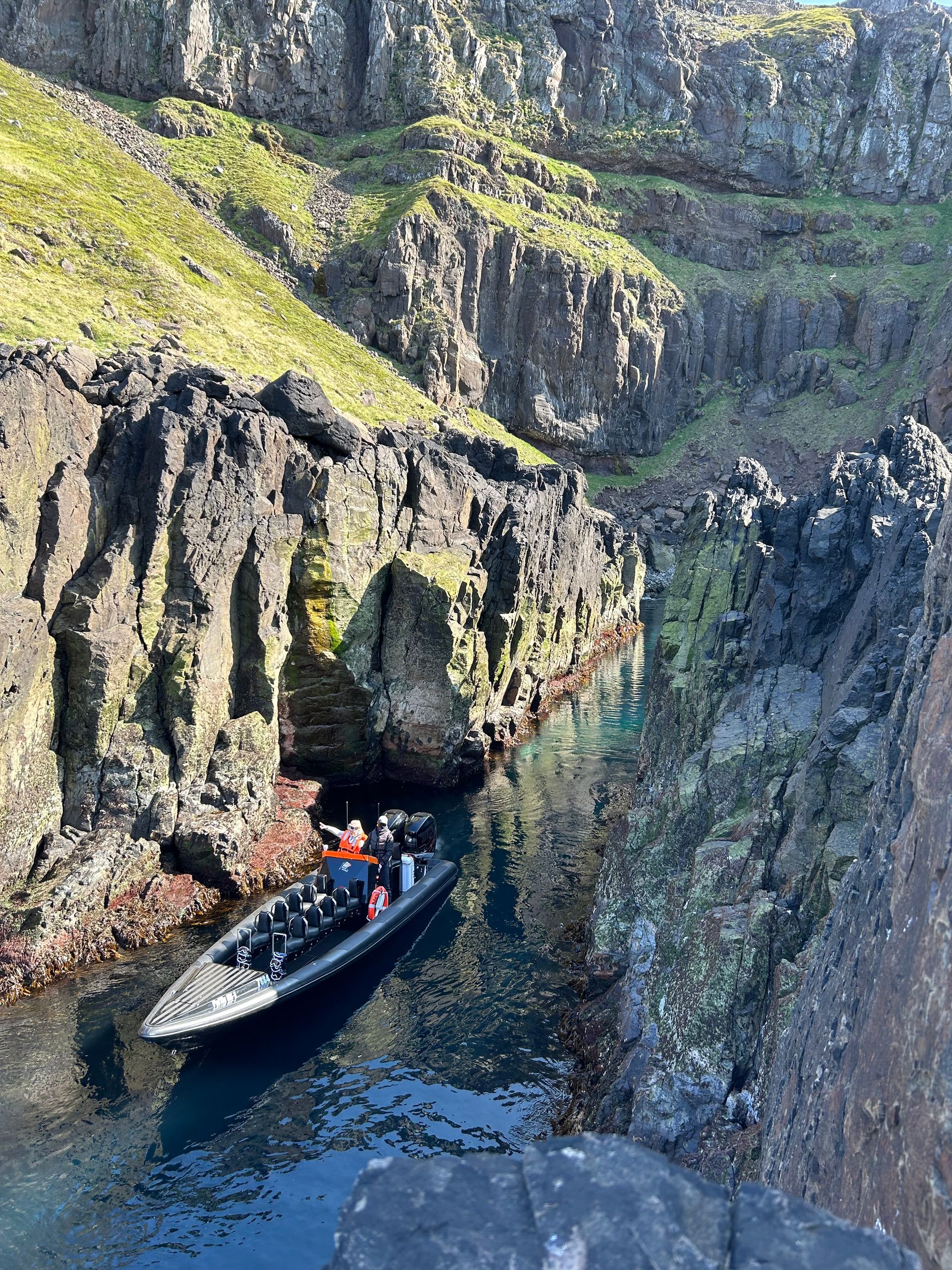 Puffin Adventure´s RIB boat exploring Sæluvogur in Borgarfjörður eystri.