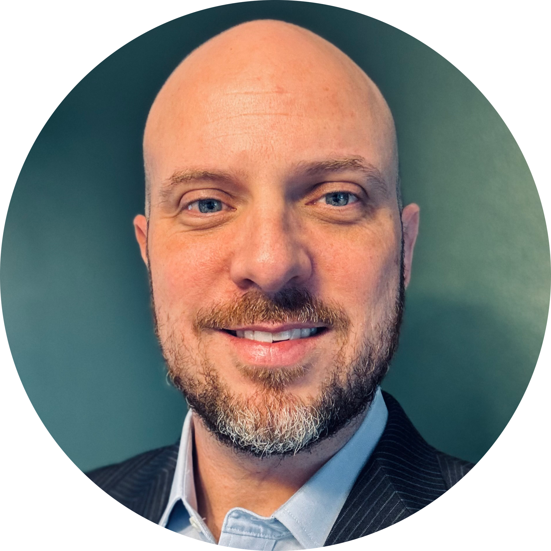 A bald man with a beard is smiling in a circle