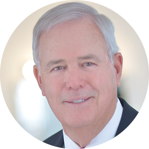 A man in a suit and tie is smiling in a circle