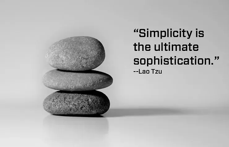A stack of rocks with a quote that says