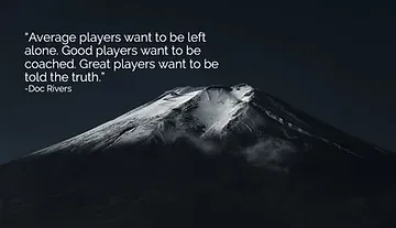 A black and white photo of a mountain with a quote on it.