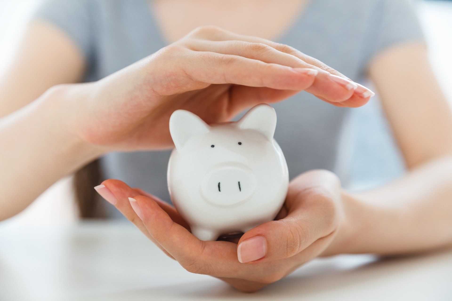 Piggy Bank in Hand — Bradenton, FL — Sound Wealth Management Piggy Bank in Hand — Bradenton, FL — Sound Wealth Management