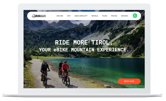 Website on a laptop with cyclists biking near a lake in the mountains.