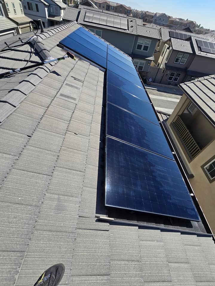 A roof with a lot of solar panels on it