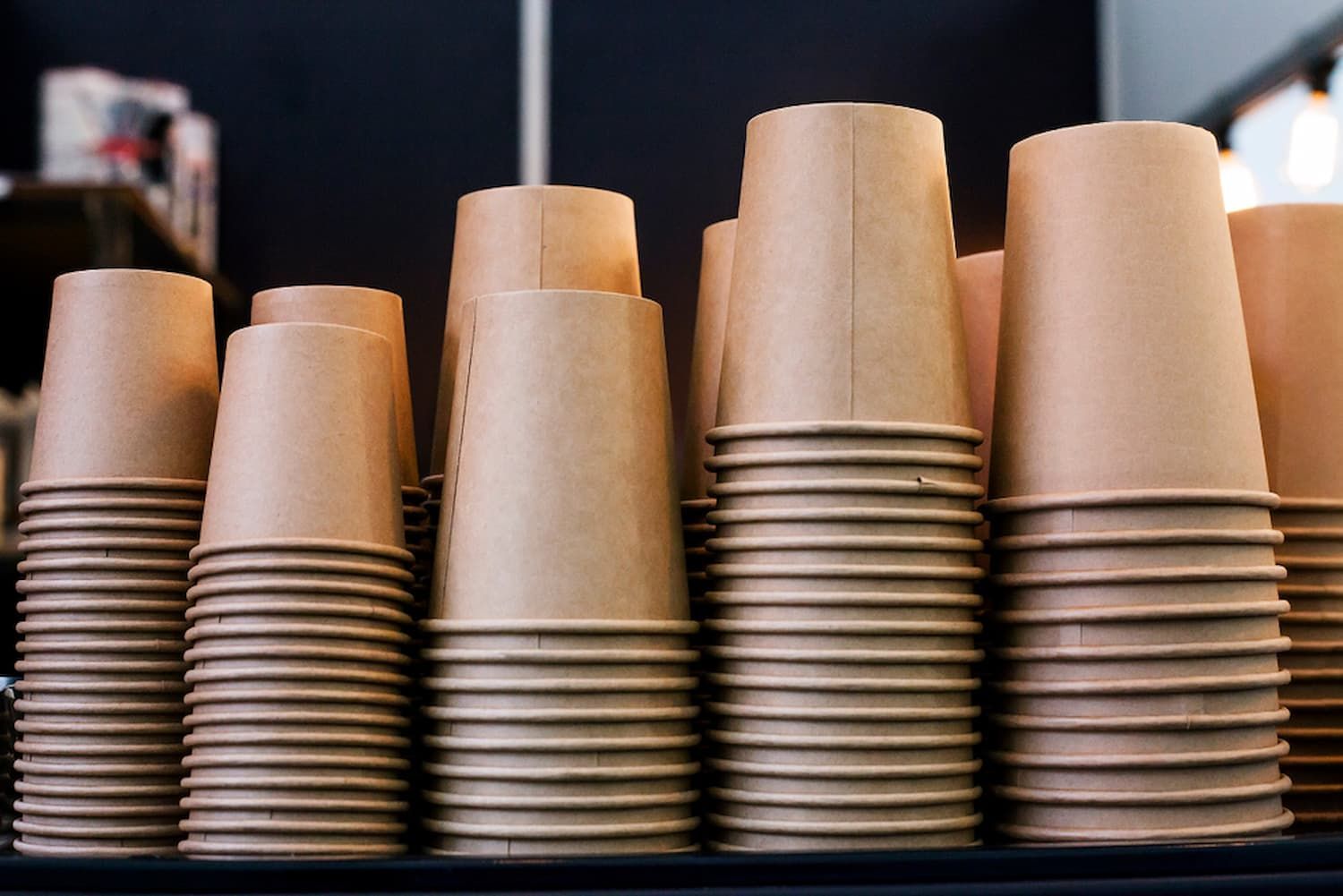 A Shelf Filled with Stacks of Brown Paper Cups — Billabong Springs in Gold Coast, QLD