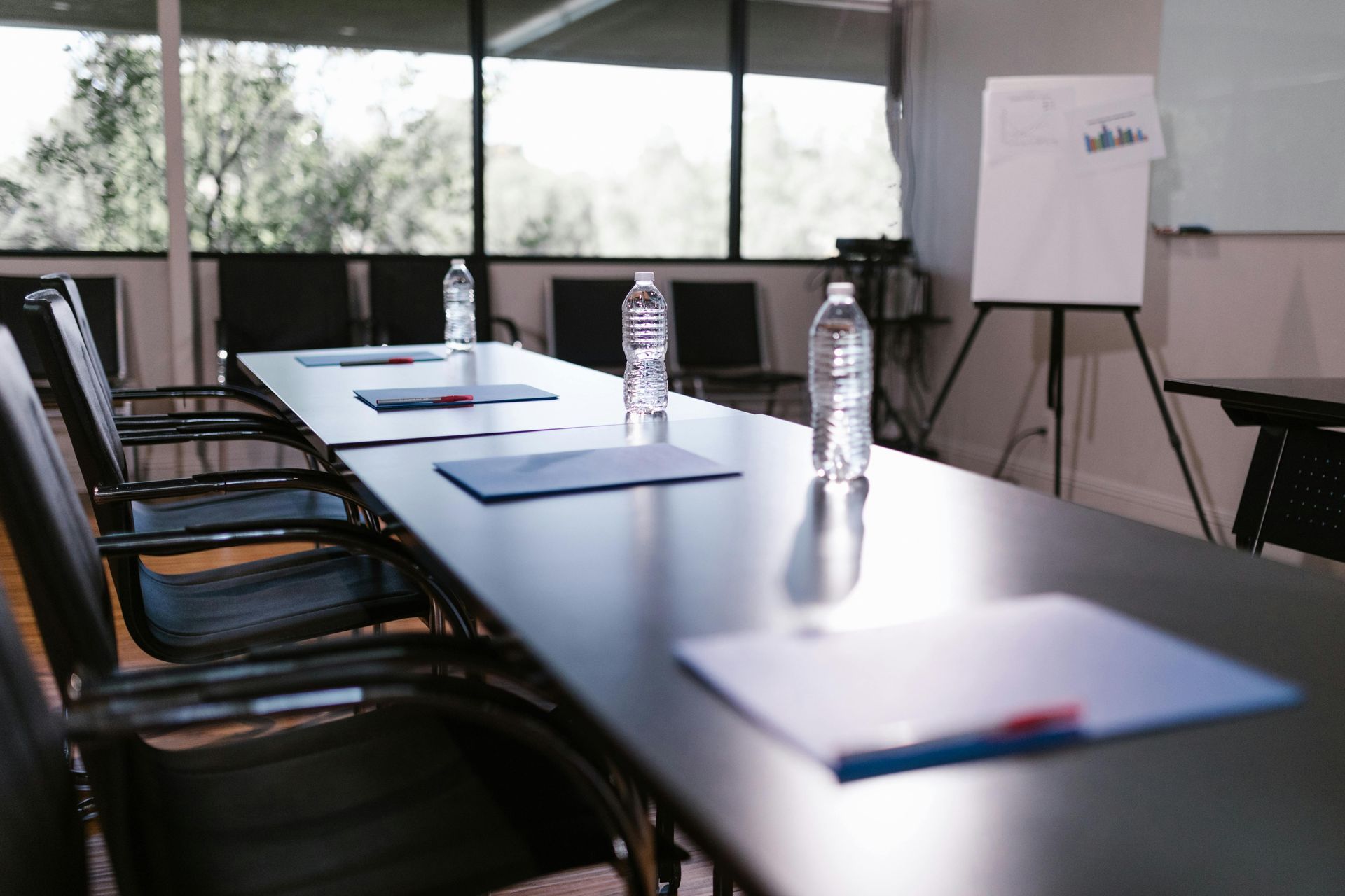 A Conference Room With A Long Table And Chairs Set Up For A Meeting — Billabong Springs in Jimboomba, QLD