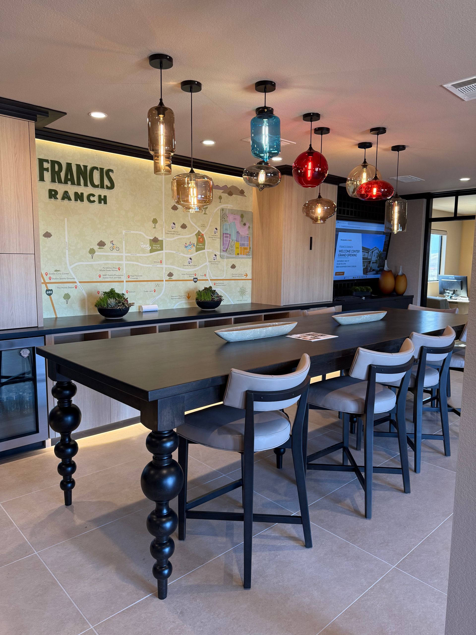 A dining room with a long table and chairs and a sign that says francis ranch