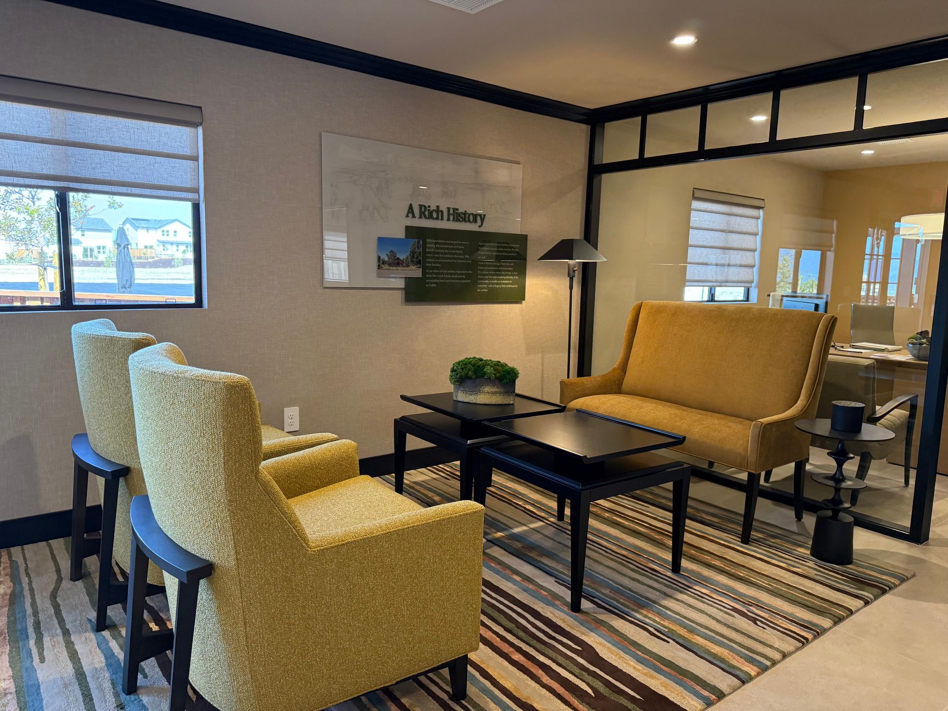 A living room with yellow chairs and a yellow couch