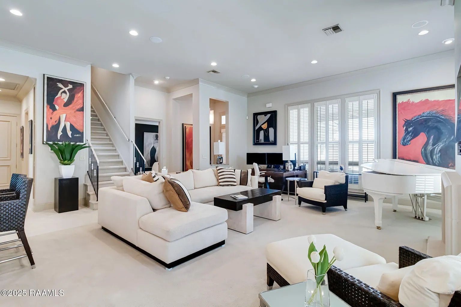 A living room filled with furniture and a piano.
