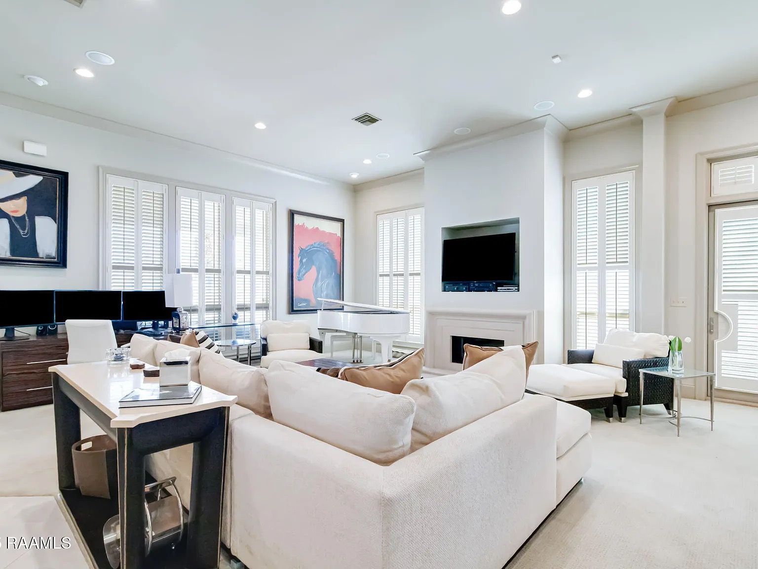A living room filled with furniture and a fireplace.