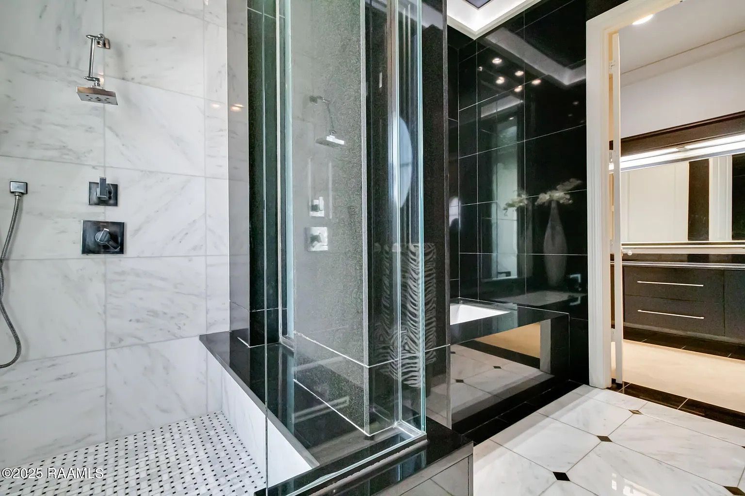A bathroom with a walk in shower and a mirror.