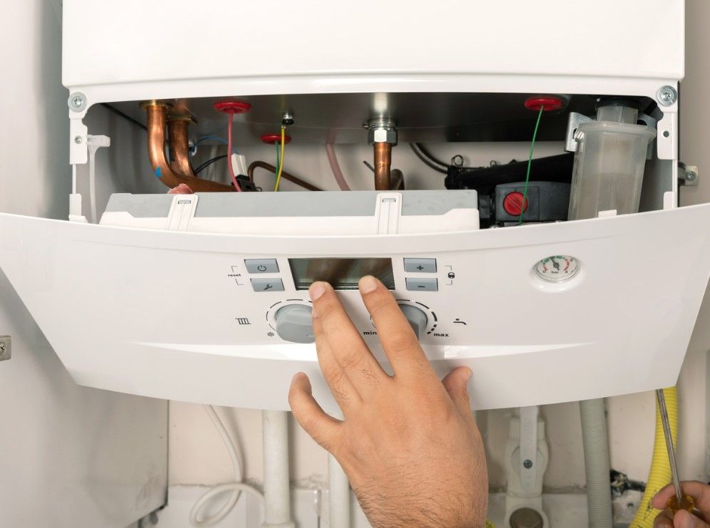 Derbyshire Plumbing & Heating Specialists installing a new boiler in Derby
