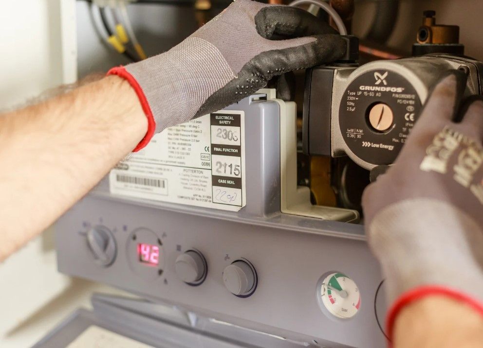 Derbyshire Plumbing & Heating Specialists carrying out a boiler service in Ilkeston