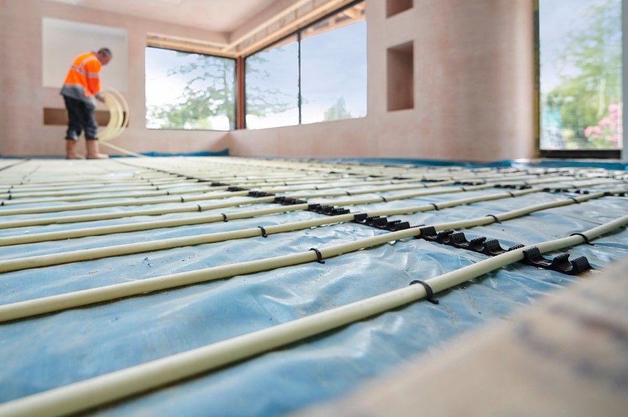 wet underfloor heating being installed by Derbyshire Plumbing & Heating Specialists