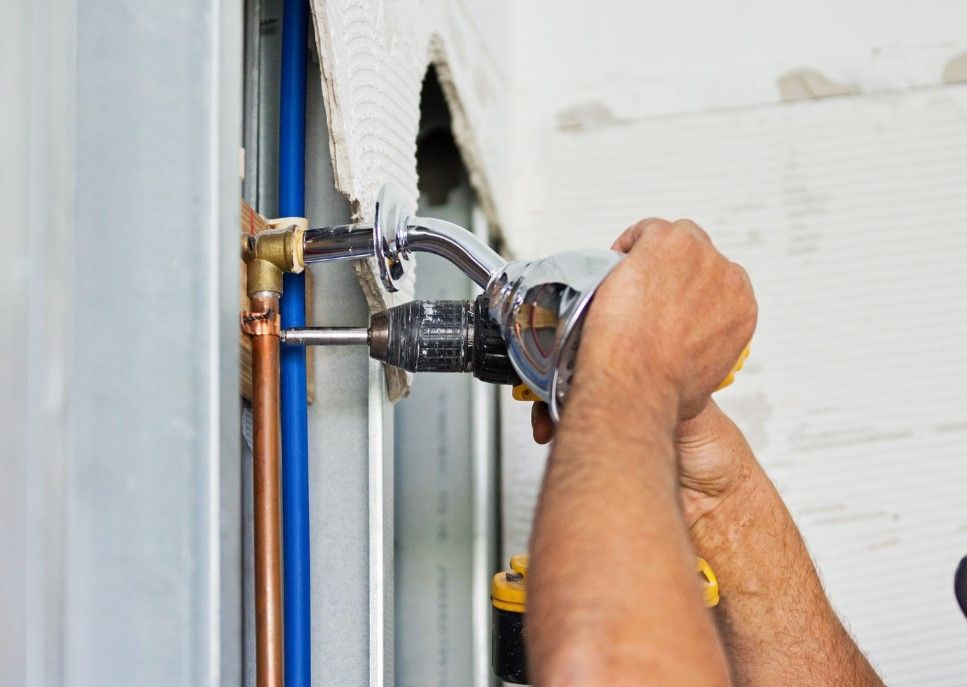 Derbyshire Plumbing & Heating Specialists installing a new shower in Chesterfield