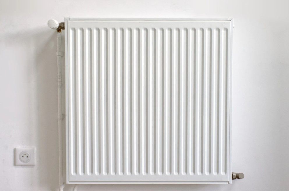 Derbyshire Plumbing & Heating Specialists about to carry out a radiator power flush in Ashbourne