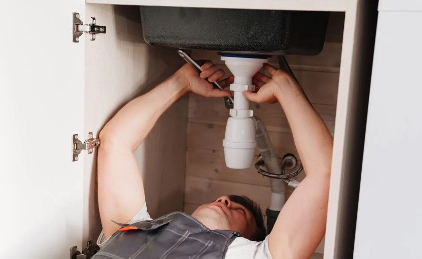 Derbyshire Plumbing & Heating Specialists unblocking a kitchen sink in Ashbourne