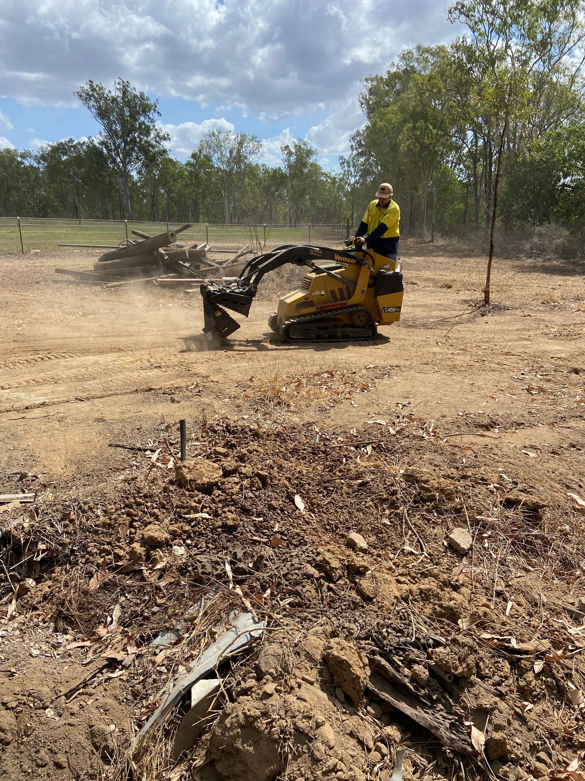 Mini Excavator Drilling Soil — RCJJ Mini Loaders In Mareeba, QLD