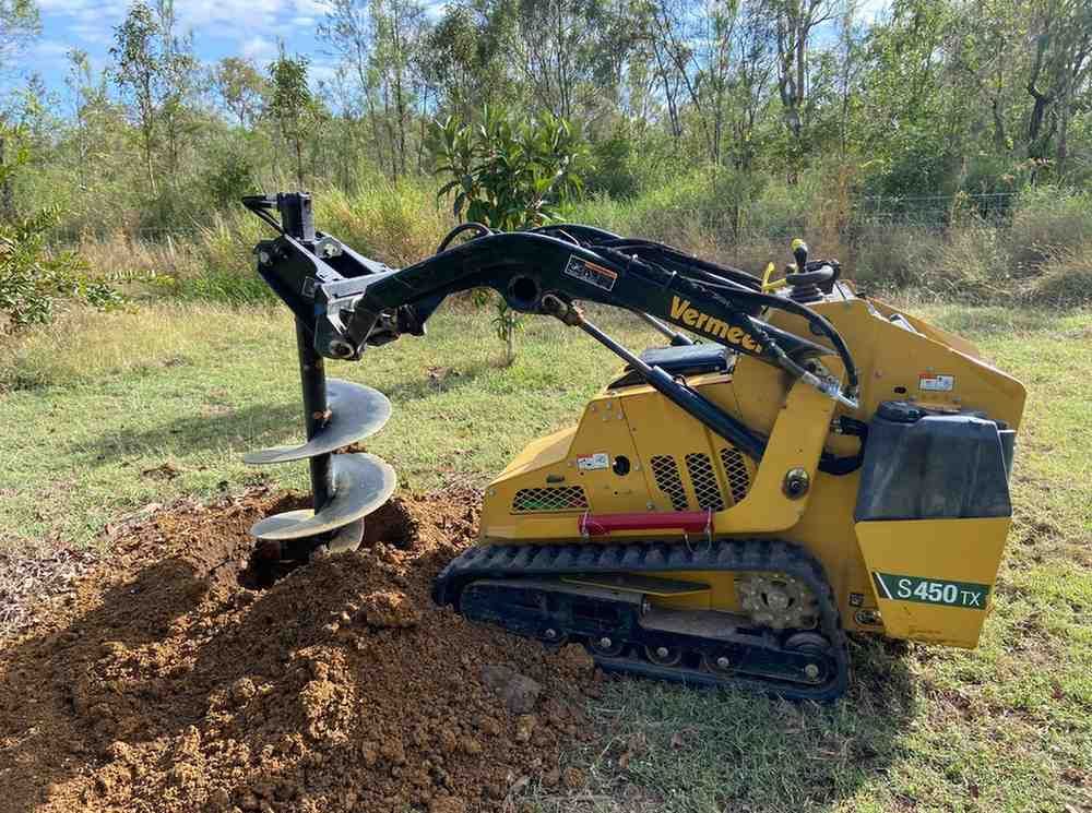 Mini Loader Drilling Soil — RCJJ Mini Loaders In Mareeba, QLD