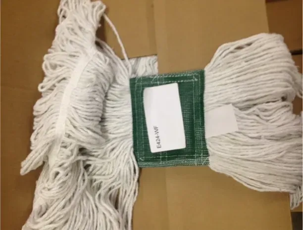 A mop with a label that says ' extra soft ' on it