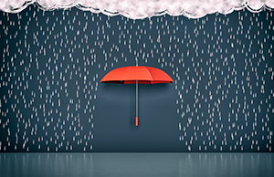 Red umbrella open in front of a blue wall during a rain shower.
