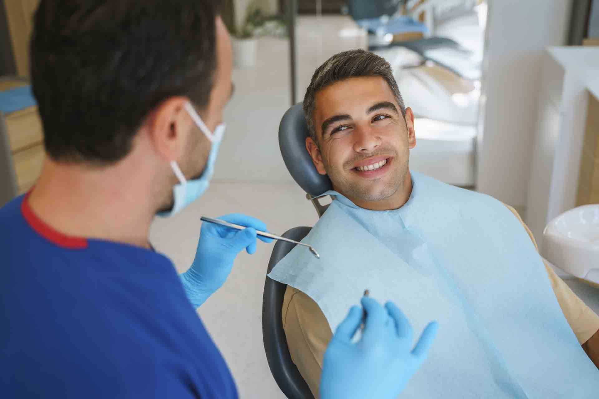 Young Man Patient Having Dental Treatment — Antigo, WI — Antigo's Complete Dental Center