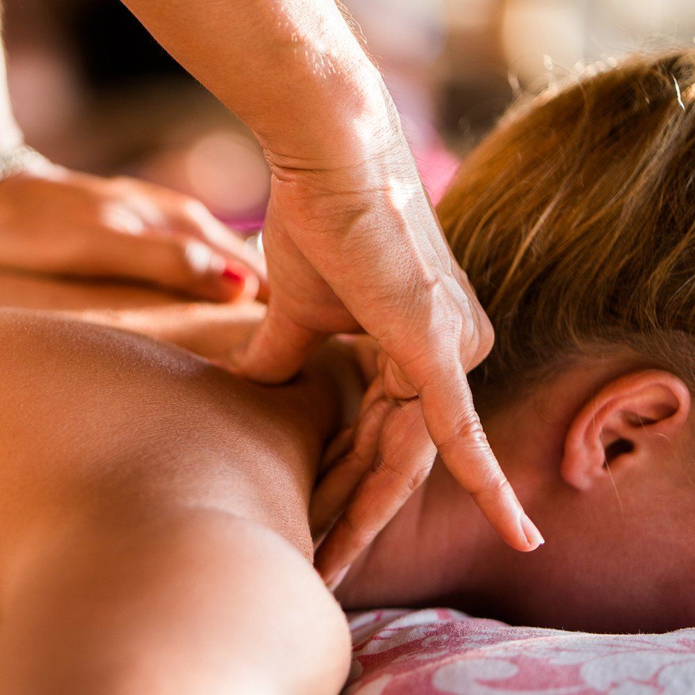 Massaging Woman's Neck — Great Neck, NY — Butterfly Garden Spa Massaging Woman's Neck — Great Neck, NY — Butterfly Garden Spa