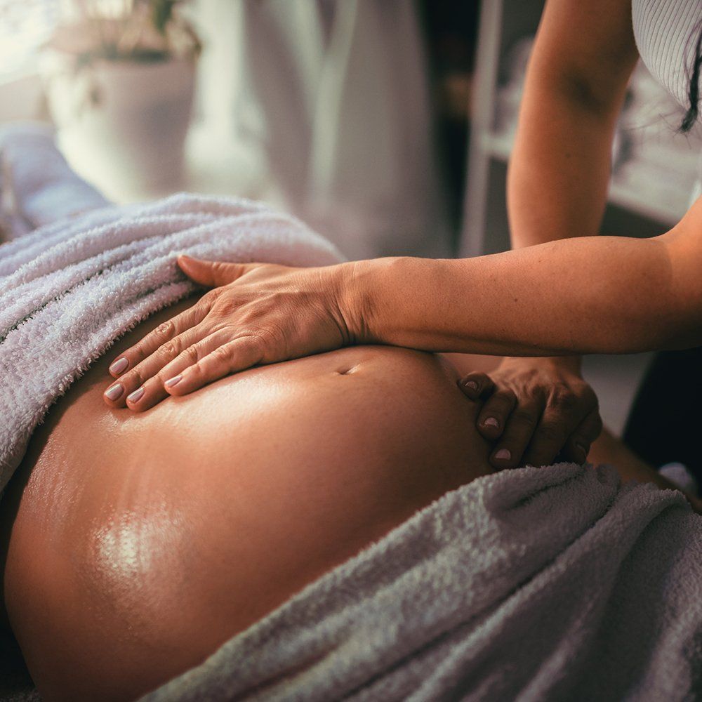 Pregnant Woman Receiving A Massage — Great Neck, NY — Butterfly Garden Spa Pregnant Woman Receiving A Massage — Great Neck, NY — Butterfly Garden Spa